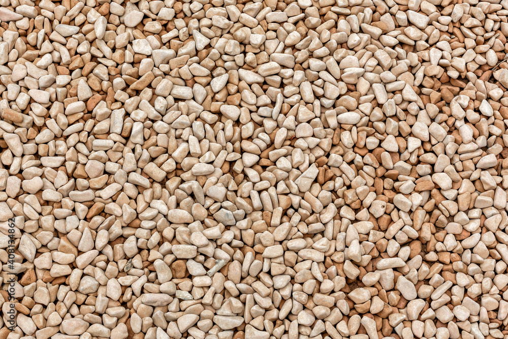 Small naturally polished gray pebbles background Small naturally polished gray pebbles background