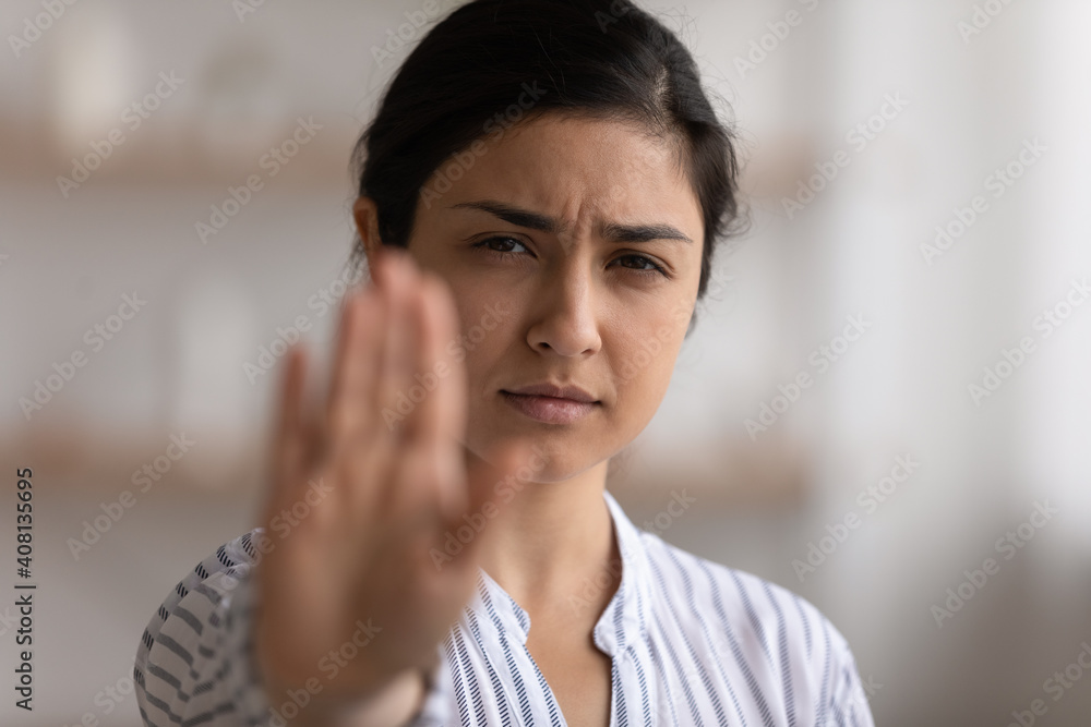 I say enough. Portrait of desperate indian woman showing stop gesture to any manifestations of racial gender discrimination. Strong hindu lady look at camera defend female right for free determination I say enough. Portrait of desperate indian woman showing stop gesture to any manifestations of racial gender discrimination. Strong hindu lady look at camera defend female right for free determination