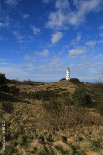 Gorgeous hillside landscape with lighthouse on the German Baltic island of Hiddensee in portrait format.