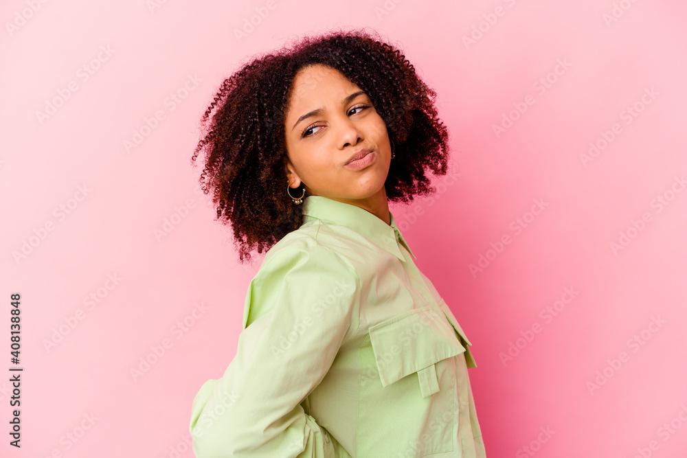 Young african american mixed race woman isolated suffering a back pain. Young african american mixed race woman isolated suffering a back pain.