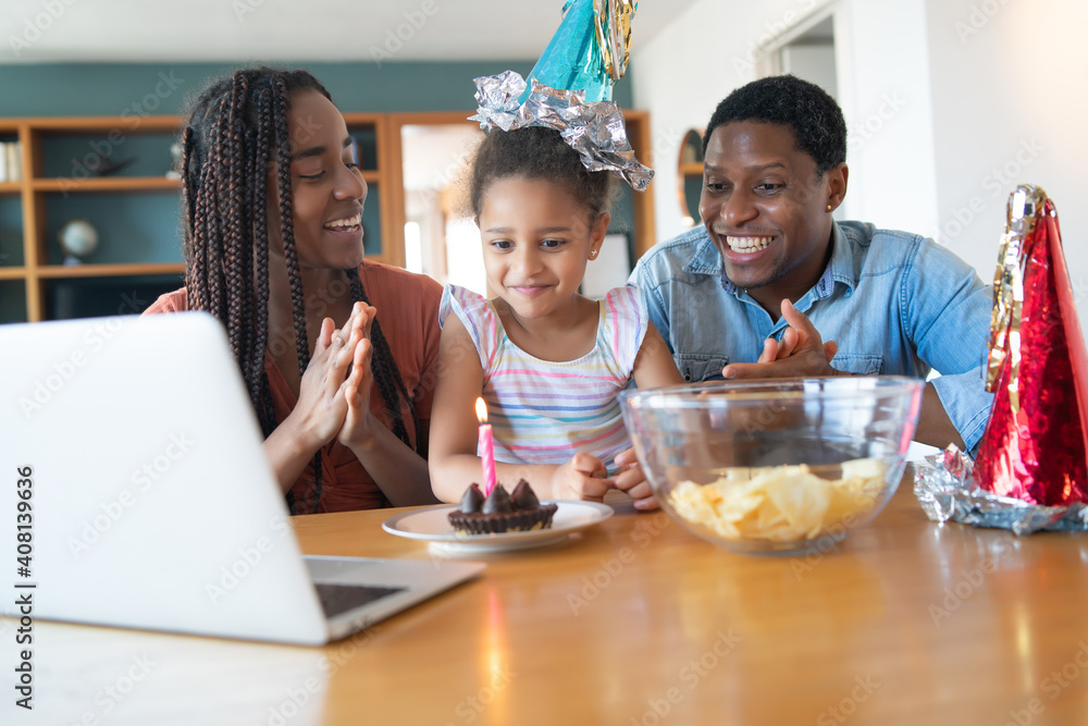 Family celebrating birthday on a video call. Family celebrating birthday on a video call.