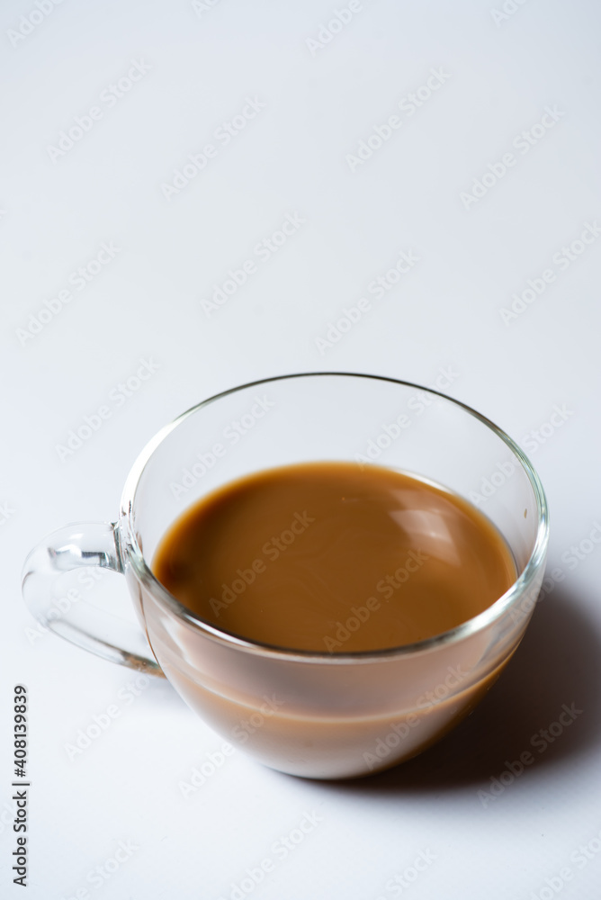 Clear glass of white coffee on white background Clear glass of white coffee on white background