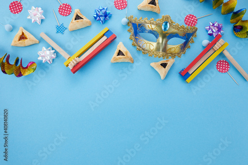 Purim celebration concept. Jewish carnival background. Top view. Flat lay photo