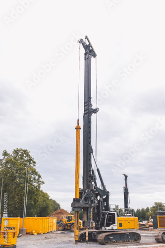 A pile driver on the construction site 