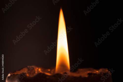 Dark background with candle flame