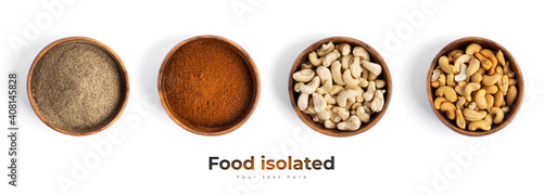 Spices, nuts in wooden bowl isolated on a white background.