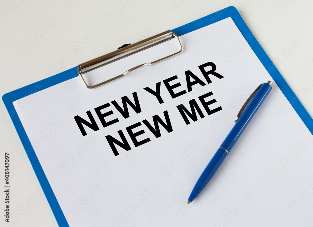 Clipboard with text New Year New me and blue pen Clipboard with text New Year New me and blue pen