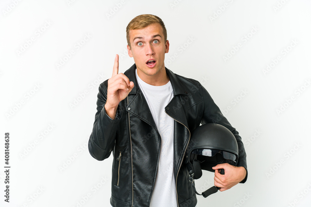 Young caucasian man holding a motorbike helmet isolated on white background Young caucasian man holding a motorbike helmet isolated on white background