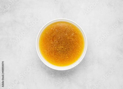 beef broth on gray concrete background photo