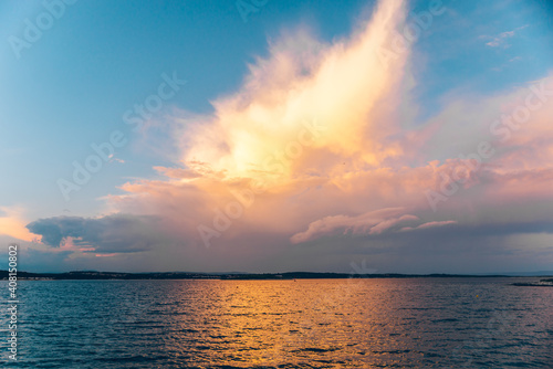 sunset over sea water bay