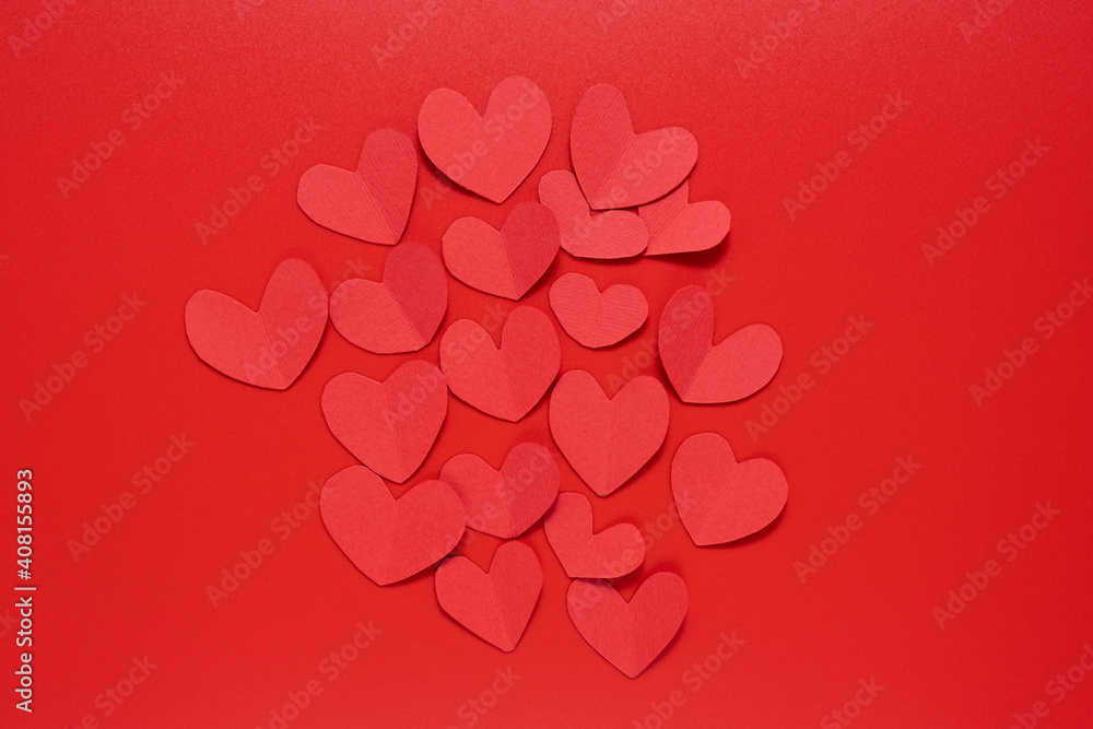 Paper red heart on a red background. Valentine's Day. Valentine's Day February 14. Paper red heart on a red background. Valentine's Day. Valentine's Day February 14.