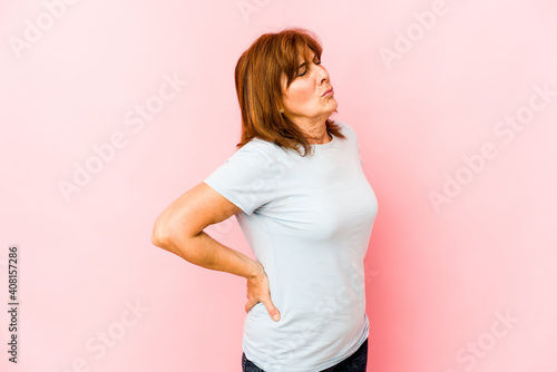 Senior caucasian woman isolated suffering a back pain.