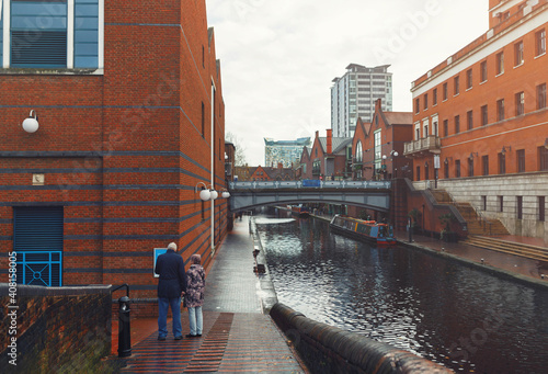 Alleys following Birmingham's canals are a great place for taking a romantic walk in evening. Amazing view will delight not only tourists but also citizens living in surrounding neighborhoods. photo