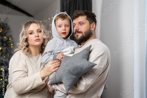 Happy family concept. Husband hug belly pregnant wife standing indoor living room near sofa