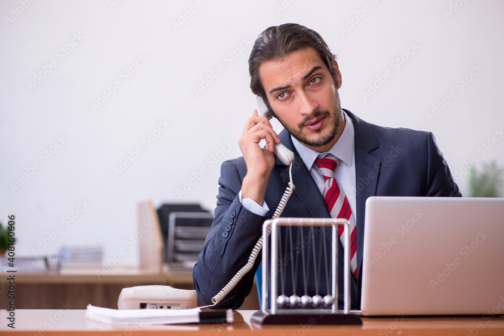 Young man businessman employee sitting in the office Young man businessman employee sitting in the office