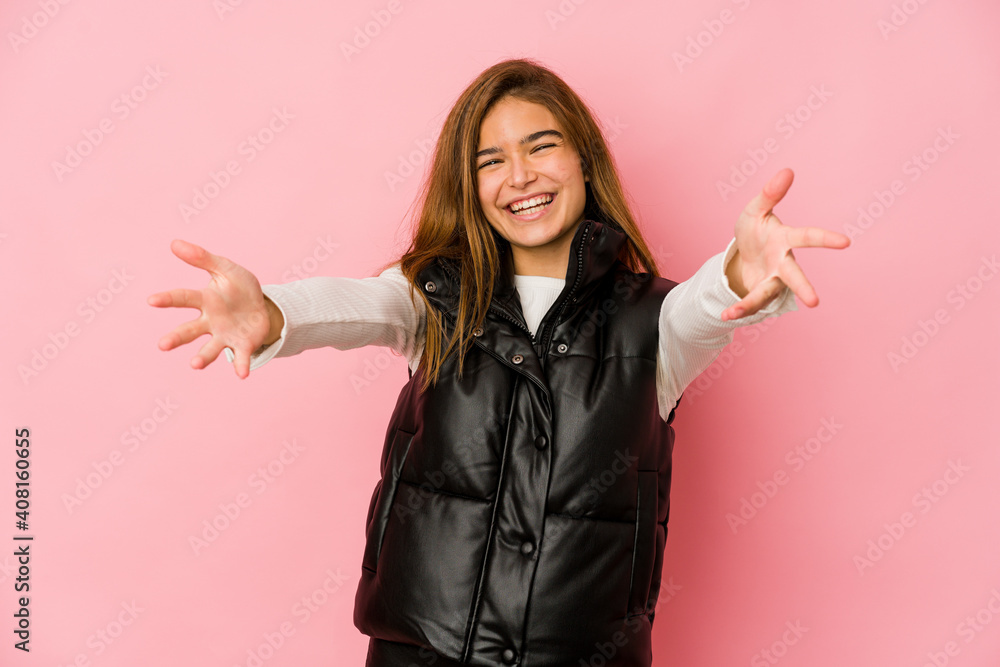 Young skinny caucasian teenager girl feels confident giving a hug to the camera. Young skinny caucasian teenager girl feels confident giving a hug to the camera.