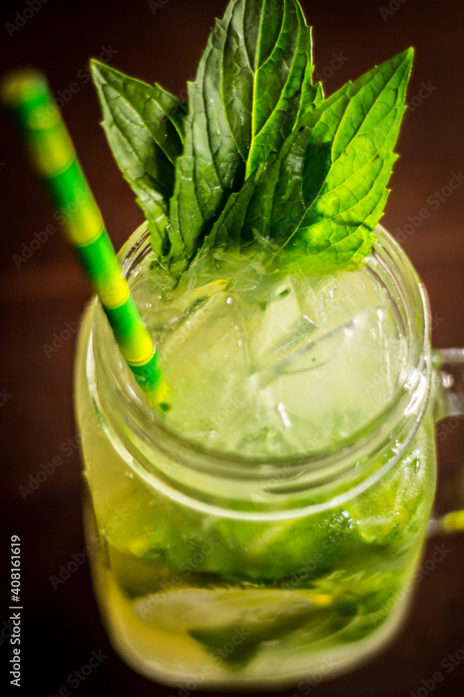 Mojito cocktail fruit alcohol drink beverage with ice straw and bokeh background Mojito cocktail fruit alcohol drink beverage with ice straw and bokeh background