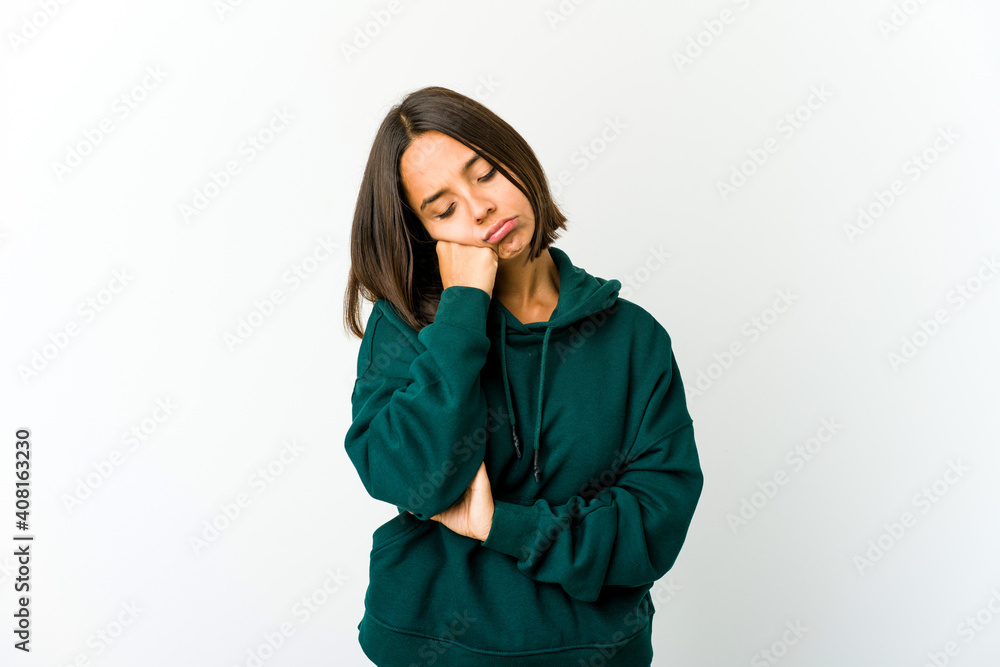 Young mixed race woman tired of a repetitive task. Young mixed race woman tired of a repetitive task.