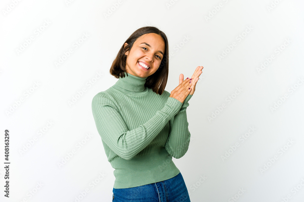 Young mixed race woman feeling energetic and comfortable, rubbing hands confident. Young mixed race woman feeling energetic and comfortable, rubbing hands confident.