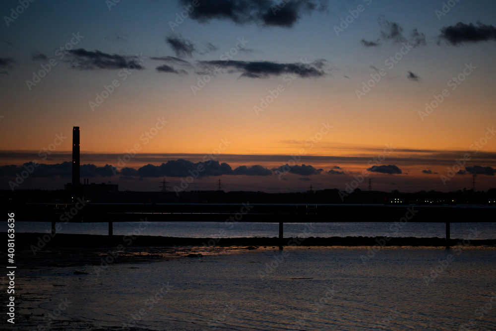 Power Station at dusk. Landmark energy production fossil fuels pollution environmental impact