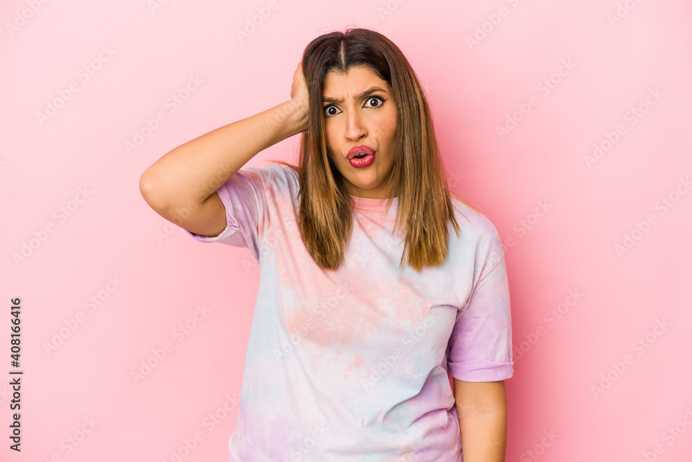 Young indian woman isolated on pink background being shocked, she has remembered important meeting. Young indian woman isolated on pink background being shocked, she has remembered important meeting.