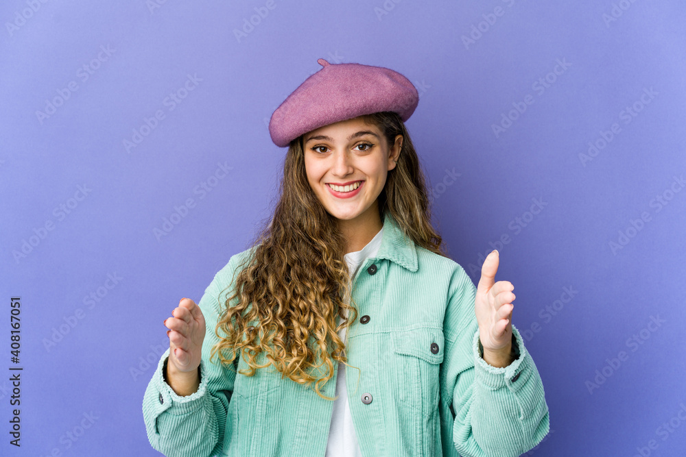 Young caucasian cute woman holding something with both hands, product presentation. Young caucasian cute woman holding something with both hands, product presentation.