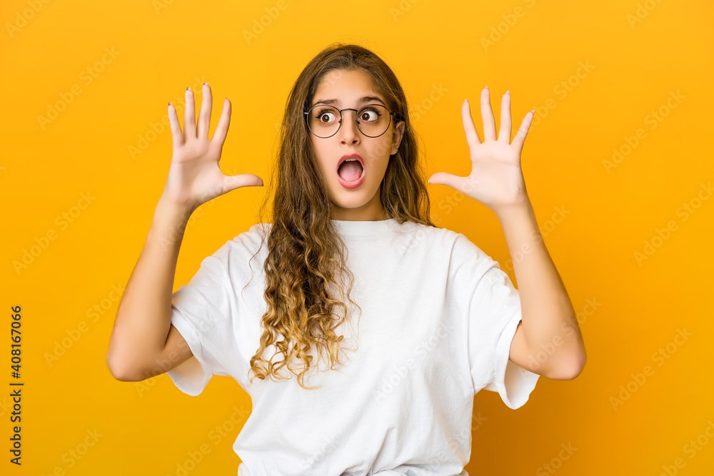 Young caucasian woman screaming to the sky, looking up, frustrated. Young caucasian woman screaming to the sky, looking up, frustrated.
