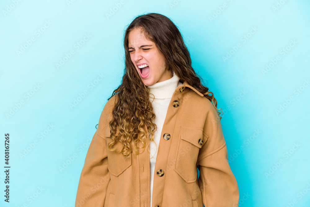 Young caucasian curly hair woman isolated shouting very angry, rage concept, frustrated. Young caucasian curly hair woman isolated shouting very angry, rage concept, frustrated.