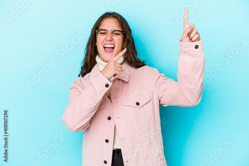 Young caucasian curly hair woman isolated dancing and having fun. photo