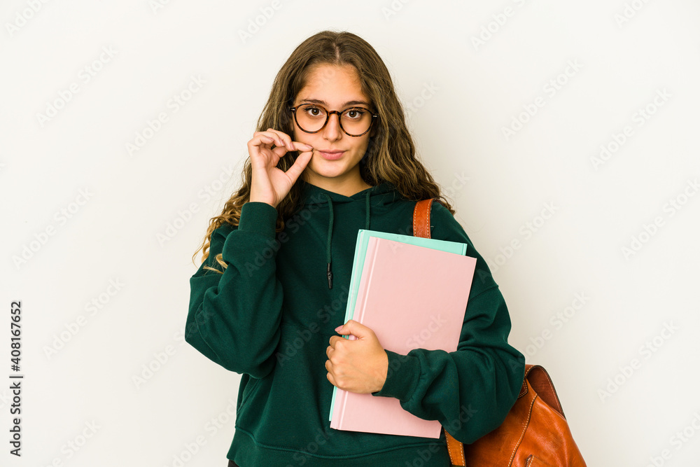 Young caucasian student woman isolated with fingers on lips keeping a secret. Young caucasian student woman isolated with fingers on lips keeping a secret.