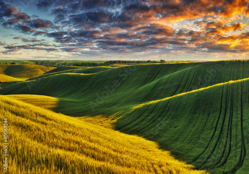 picturesque clouds over a hilly field. dramatic sky over rural landscape