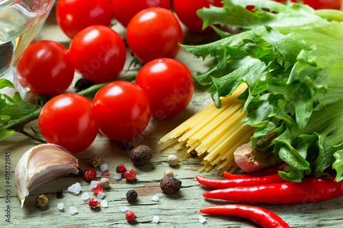 Ingredients for making pasta with tomato sauce.