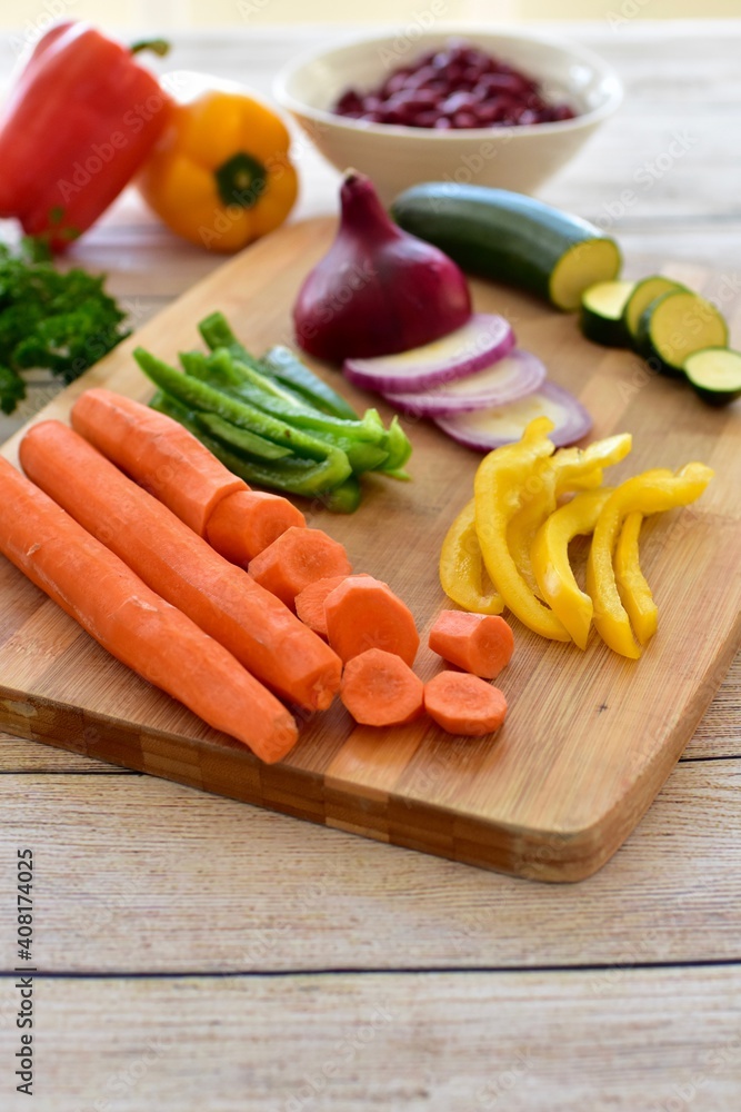 Chopped fresh vegetarian ingredients for making hearty healthy winter soups, stews and chilis Chopped fresh vegetarian ingredients for making hearty healthy winter soups, stews and chilis