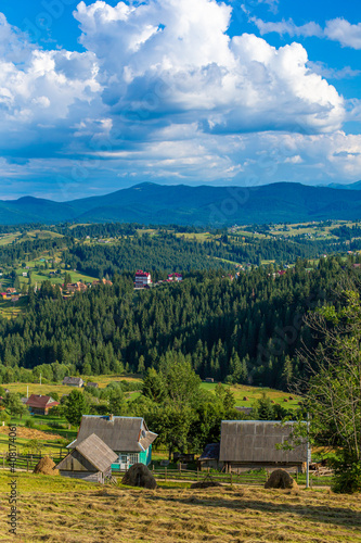 Beautiful summer landscape of village among Karpaty mountains