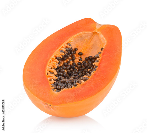 whole and half ripe papaya isolated on white background