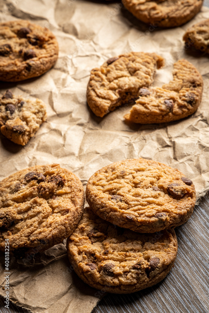 freshly baked Chocolate chip cookies on a wooden table with place for text. Copy space. freshly baked Chocolate chip cookies on a wooden table with place for text. Copy space.