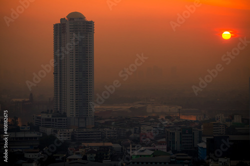 The high angle background of the city view with the secret light of the evening, blurring of night lights, showing the distribution of condominiums, dense homes in the capital community