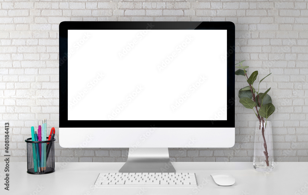 Fototapeta premium Mockup display screen blank computer on desk with white wall, office and workspace, monitor with empty, office and workplace in room, copy space, modern and minimalist, indoor, creativity and decor.