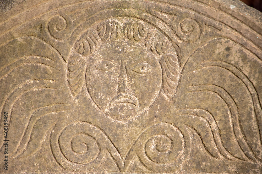 Obraz premium Detail of Headstone at Sawyer Hill Buying Ground, Newburyport MA. Built in 1695. Beautifully carved gravestone from the 1700's close up. Historic site.