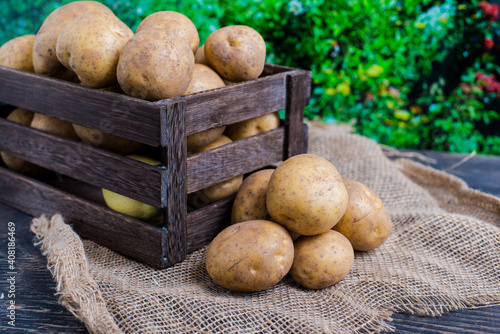 wooden box with potatoes