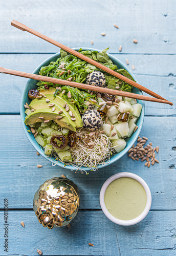 Healthy poke bowl in wood background photo