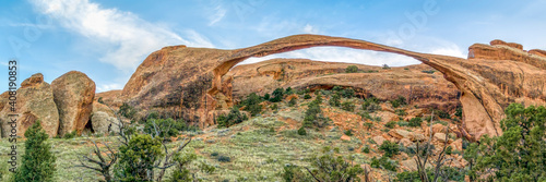 Photo Spanning over three hundred feet, Landscape Arch is a rock formation of sandstone in the high Utah desert of Arches National Park near Moab