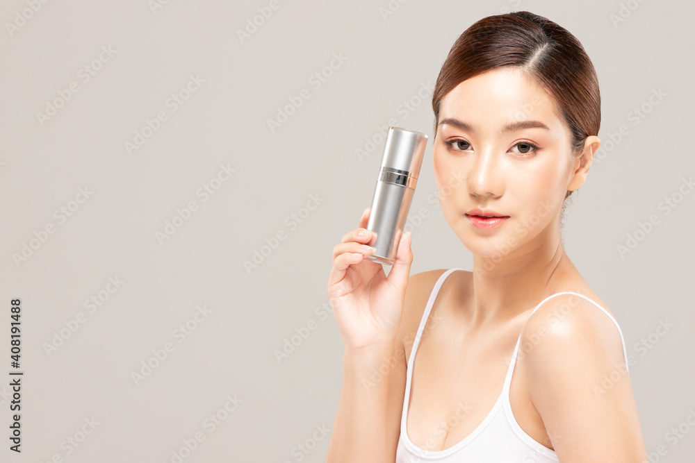 Beauty asian woman hold bottle cosmetic cream lotion and cheerful. Beauty asian woman hold bottle cosmetic cream lotion and cheerful.
