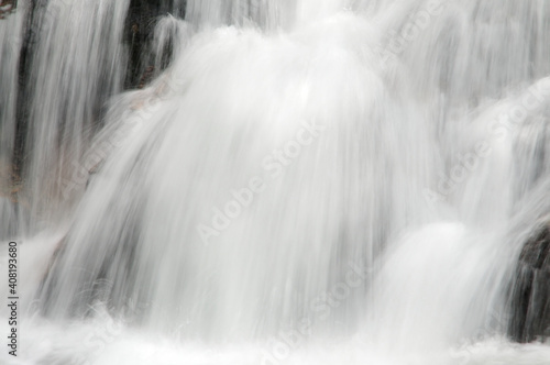 Mountain Water Cascading  Over Rocks
