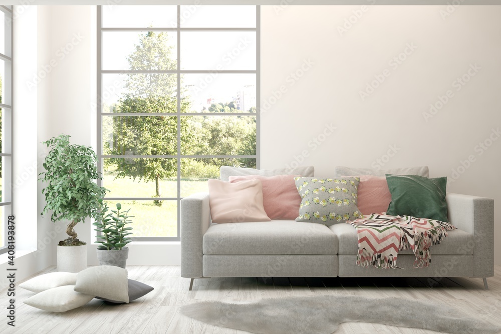 Fototapeta premium White living room with sofa and summer landscape in window. Scandinavian interior design. 3D illustration