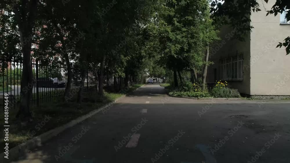 Drone view of asphalt road near preschool buildingand among trees. Around the kindergarten, a fence made of metal rods. Summer day
Drone view of asphalt road near preschool buildingand among trees. Around the kindergarten, a fence made of metal rods. Summer day
