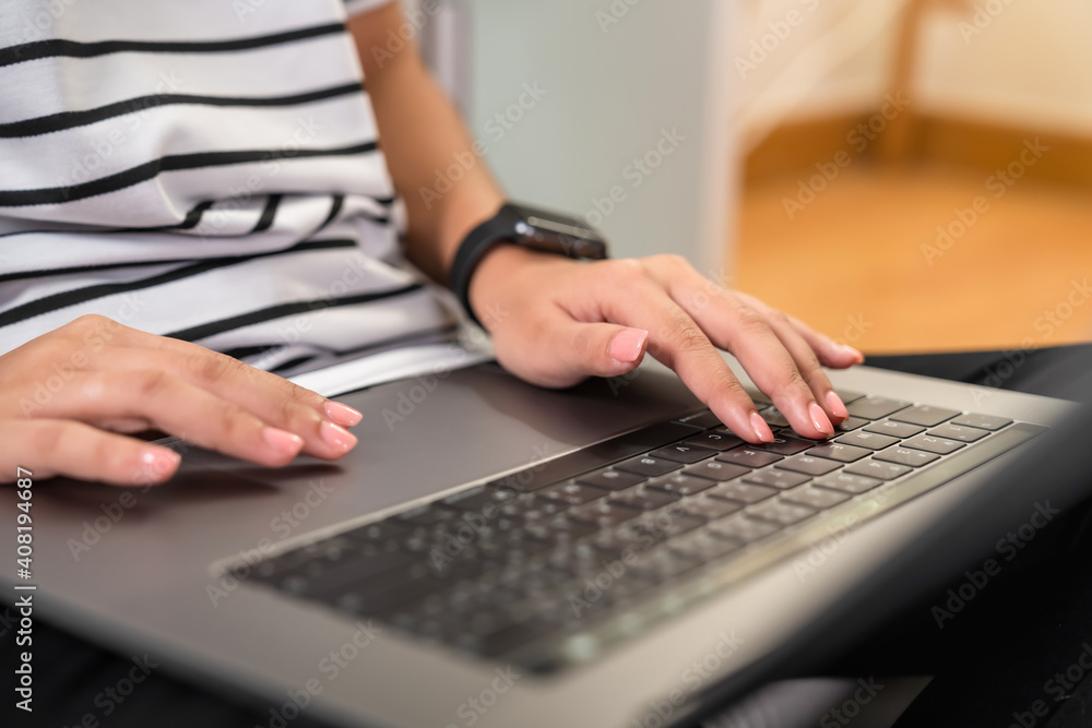 Hand using digital laptop on the table in office and wear smartwatch. Hand using digital laptop on the table in office and wear smartwatch.