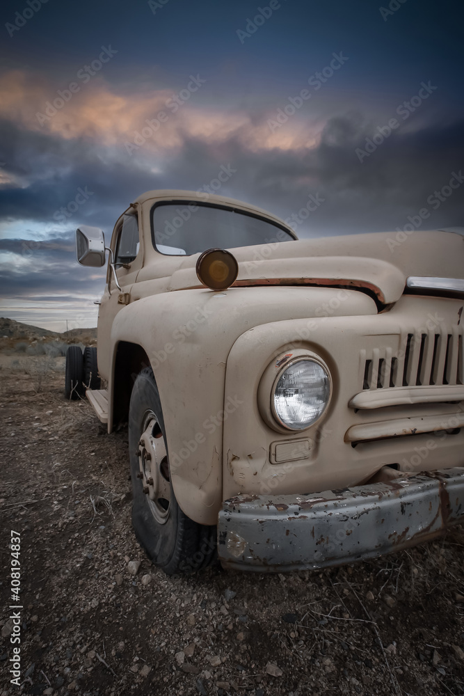 Old abandoned rusty truck with cloudy sky background Old abandoned rusty truck with cloudy sky background