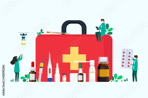 first aid kit with medicines for the throat, cold remedy, thermometer, tablets, syringe for injection. people collect medicine in first aid kit