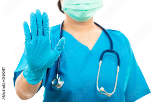woman doctor in blue uniform show hand up stop sign